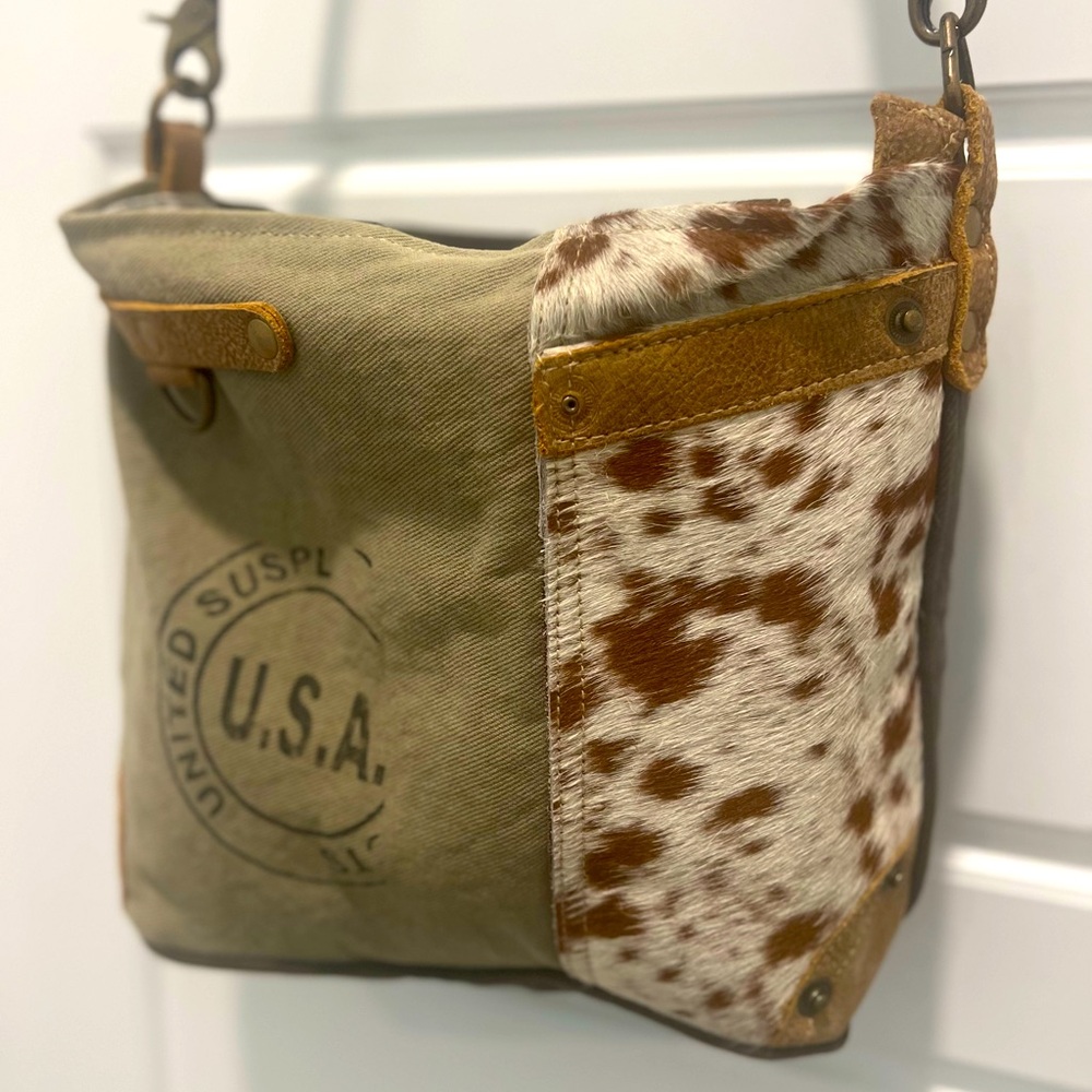 Myra bag with leather, fur and canvas.